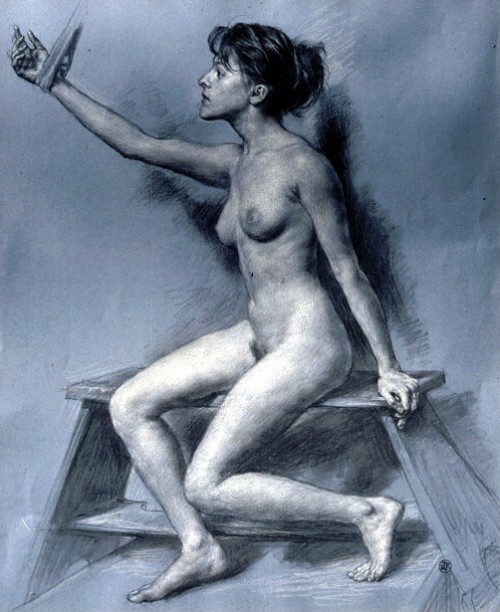 Seated Young Woman With Raised Arm